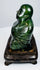 Side profile of Chinese dark green hardstone Laughing Buddha sculpture on fitted wooden stand