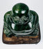 Top view of Chinese green hardstone Budai figure showing carved head, shoulders and robe details