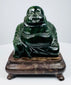 Front view of Chinese hardstone Laughing Buddha sculpture with polished dark green surface