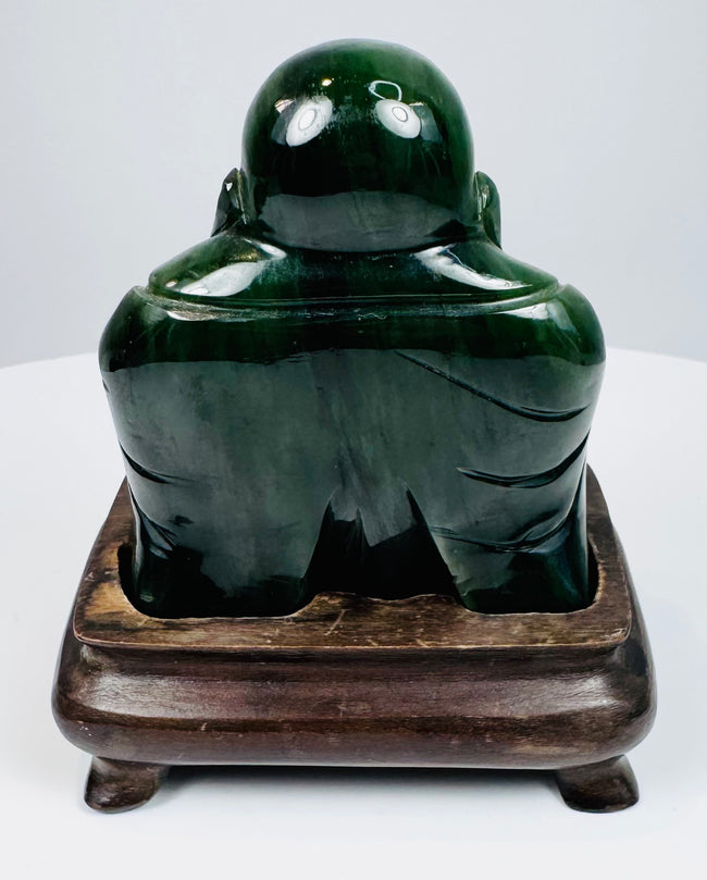 Rear view of Chinese carved green hardstone Laughing Buddha figure showing smooth rounded back