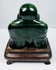 Rear view of Chinese carved green hardstone Laughing Buddha figure showing smooth rounded back