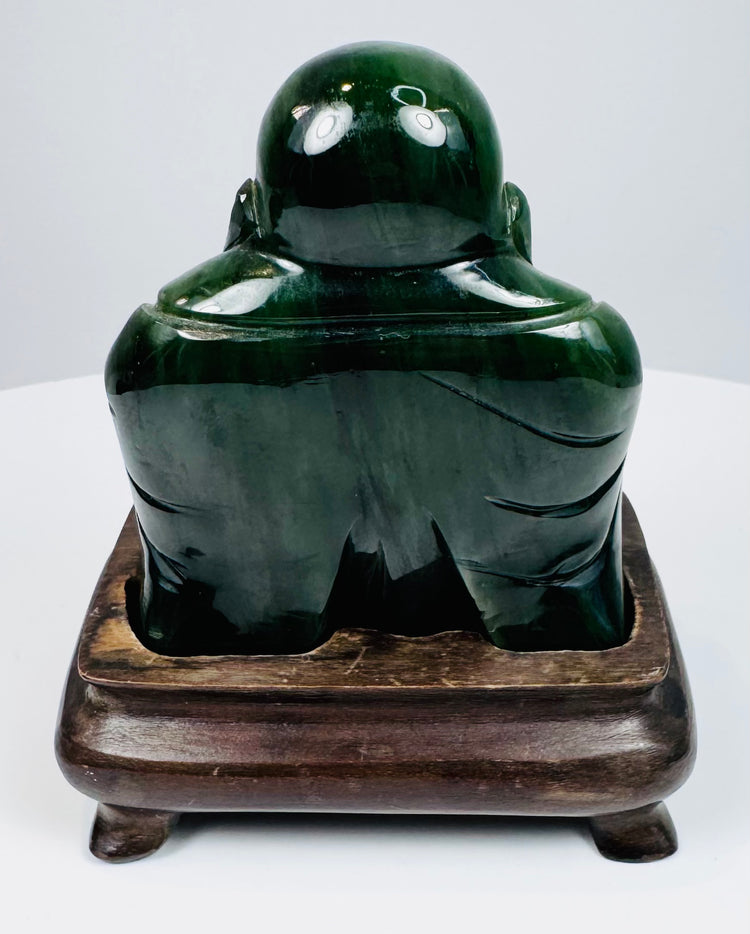 Rear view of Chinese carved green hardstone Laughing Buddha figure showing smooth rounded back