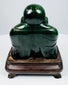 Rear view of Chinese carved green hardstone Laughing Buddha figure showing smooth rounded back
