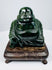 Chinese Budai hardstone carving showing smiling face, exposed belly and detailed flowing robes