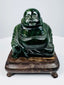Chinese Budai hardstone carving showing smiling face, exposed belly and detailed flowing robes
