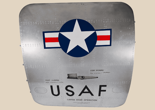 Full front view of a Boeing 737 USAF aft cargo door with Star and Bars insignia and polished aluminum skin