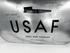 Detailed view of the Boeing aircraft cargo door latch, USAF lettering and original cargo door operation markings