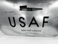 Detailed view of the Boeing aircraft cargo door latch, USAF lettering and original cargo door operation markings