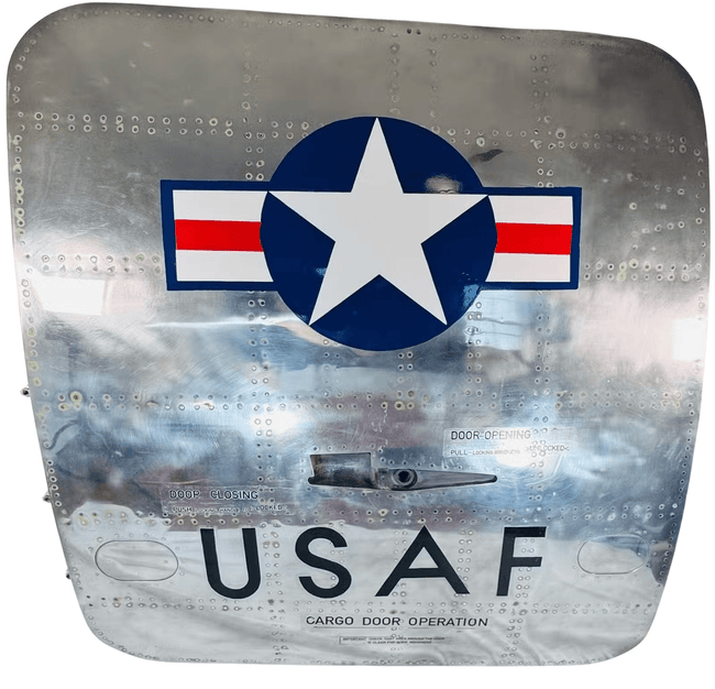 Polished aluminum USAF Boeing 737 cargo door with military insignia, original handle and service-related patina
