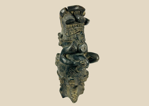 Vintage Chupícuaro-style ceramic figure from West Mexico, depicting a stylized seated form with intricate geometric motifs and applied details. Handcrafted revival piece inspired by pre-Columbian tradition, with dark burnished finish and patina.