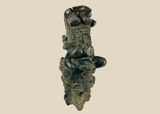Vintage Chupícuaro-style ceramic figure from West Mexico, depicting a stylized seated form with intricate geometric motifs and applied details. Handcrafted revival piece inspired by pre-Columbian tradition, with dark burnished finish and patina.