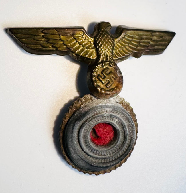 German naval cap badge showing detailed eagle feathers and gilt metal finish