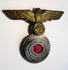 German naval cap badge showing detailed eagle feathers and gilt metal finish