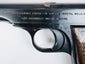 Close-up of FN factory and Browning patent lettering on the Model 1922 slide above the rounded trigger guard.