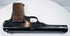FN Browning Model 1922 resting on a white surface, showing the narrow slide, rounded barrel contours, and walnut grip base.