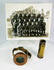 Vintage WWI military memorabilia set with soldier’s wrist compass, shell casing, and unit photo