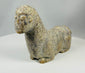 African tribal sculpture in stone with expressive eyes and minimalist design