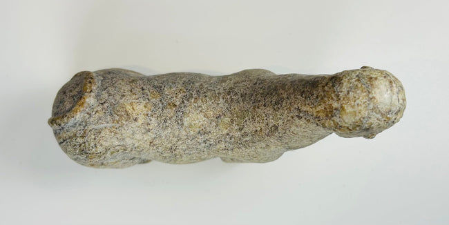 West African sculpture with primitive form and strong symbolic presence