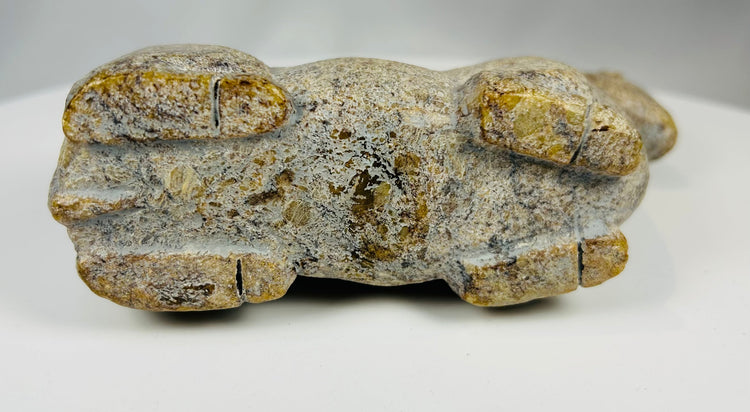 Vintage African stone effigy with minimalist carving and natural wear