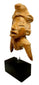 Frontal view of fragmentary terracotta human effigy with stylized headdress