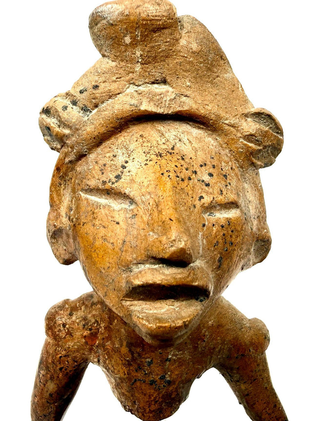 Detail shot of ancient West Mexican terracotta head with deeply incised eyes