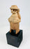 Pre-Columbian West Mexican terracotta effigy, turban headdress, perforated back disk, 100 BCE–300 CE