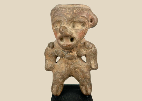 Ancient Pre-Columbian terracotta standing figure from West Mexico (Nayarit/Colima/Jalisco), circa 300 BCE–500 CE, with stylized head, pierced ears, and wide stance, mounted on a black display base, photographed on a white background