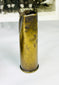 WWI military display with wrist compass, shell casing, and historic unit photograph