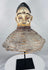 African Yoruba ancestor masquerade headdress displaying carved wood construction and surviving wicker costume framework.