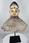 African Yoruba ancestor masquerade headdress displaying carved wood construction and surviving wicker costume framework.