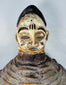 Authentic Yoruba Egungun ceremonial artifact with white pigment, red eyes, and woven costume support structure.