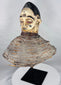 Traditional Yoruba Egungun headpiece from Nigeria with scarification details, black coiffure, and aged painted finish.