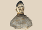 Yoruba Egungun headdress from Nigeria featuring a carved ancestral face with wicker framework and original painted surface.
