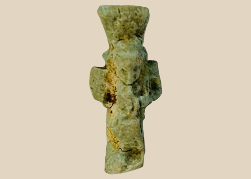 Ancient Egyptian faience amulet depicting the dwarf god Bes from the Late Period.