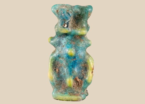 Ancient Egyptian blue-green faience amulet depicting the protective deity Bes from the Late Period.