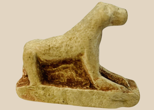 Ancient Egyptian carved limestone lioness figure from the Late Period resting on rectangular base.