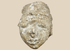 Ancient Gandharan Buddhist stucco head fragment mounted on a wooden display base