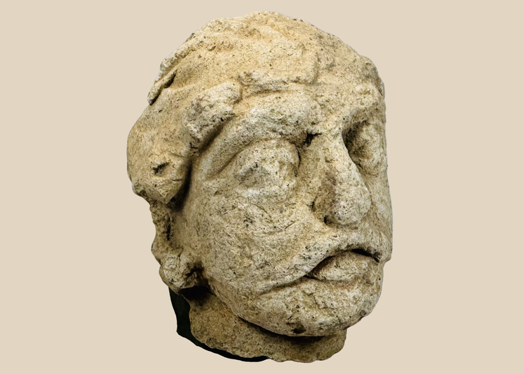 Ancient Gandharan limestone head fragment depicting a Bodhisattva traditionally identified as Maitreya, dating to the Kushan Period.