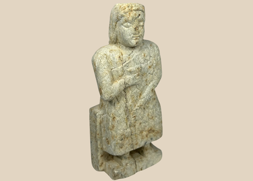 Ancient Mesopotamian stone worshipper figurine with clasped hands