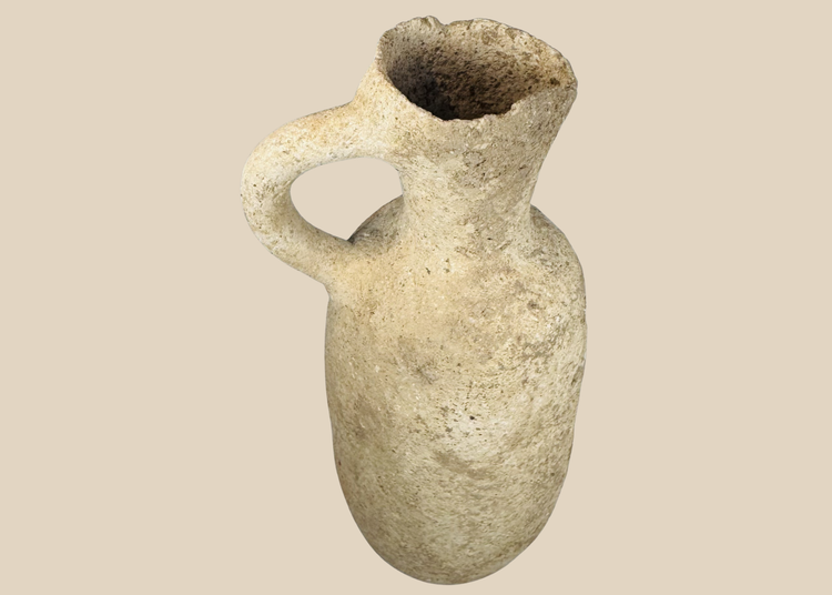 Authentic Roman Provincial terracotta pouring vessel dating to circa 100–500 CE with a globular body and loop handle.