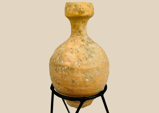 Ancient Roman terracotta oil vessel with globular body and mineral encrustation