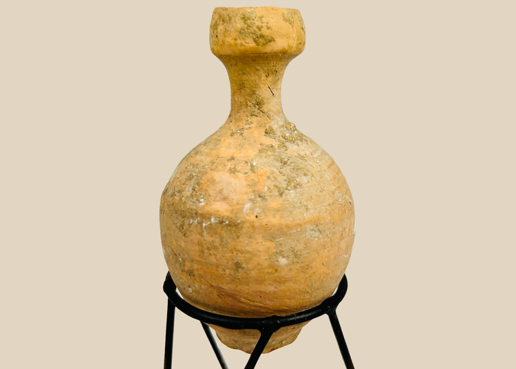 Ancient Roman terracotta oil vessel with globular body and mineral encrustation