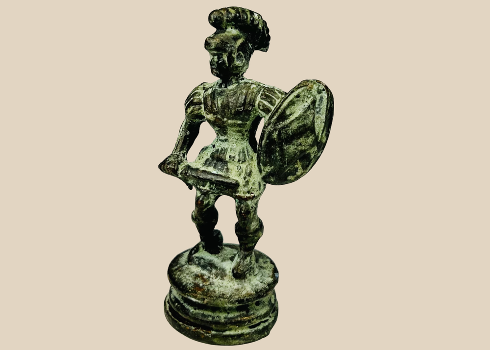 Antique bronze classical warrior figure with helmet, shield, and sword