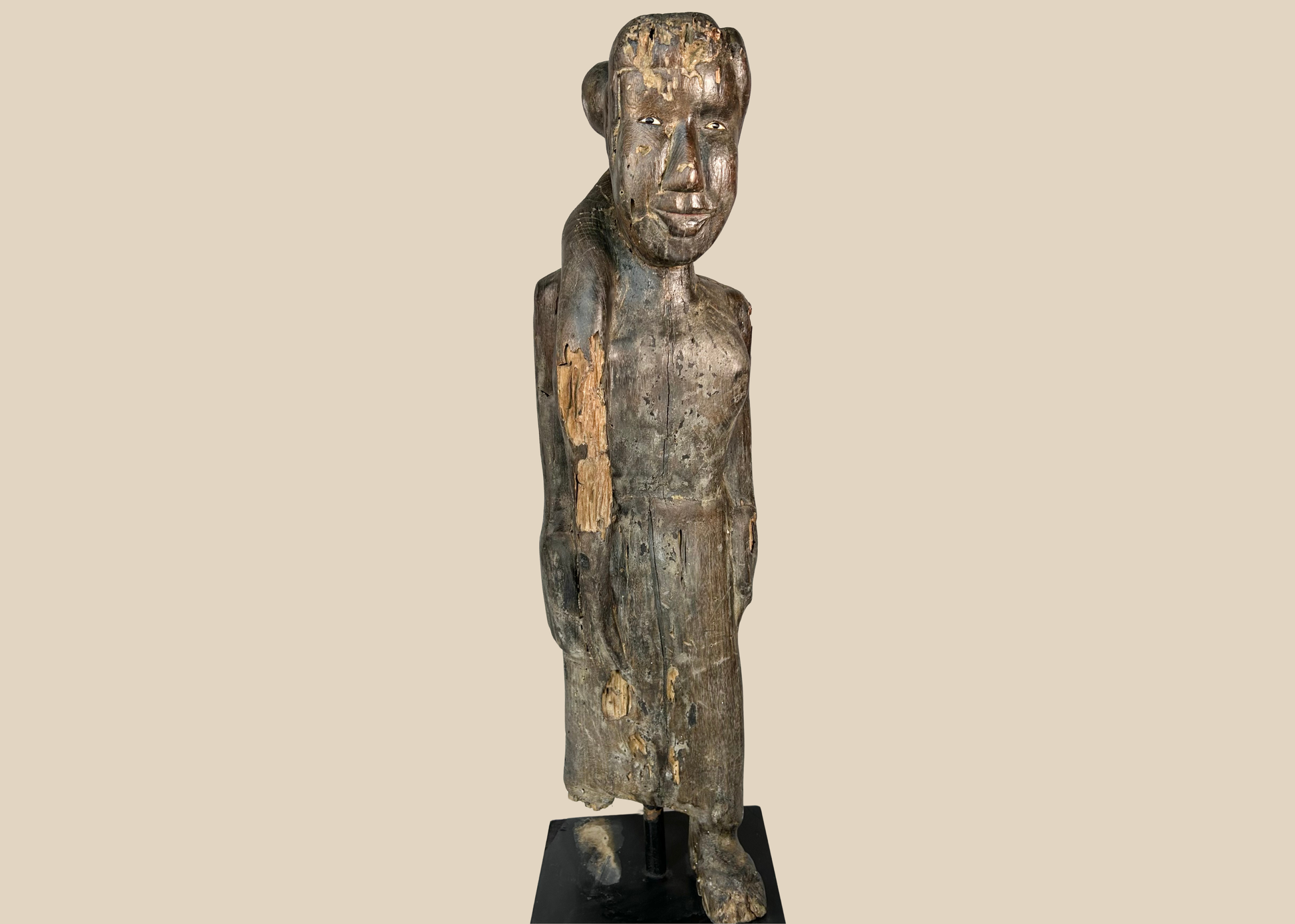 Antique Dayak ancestral wooden figure from Borneo with encrusted patina