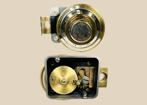 Early 20th century safe lock with exposed internal gears and rotating dial