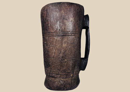 Antique Himalayan hand-carved wooden vessel traditionally used for yak milk or butter storage