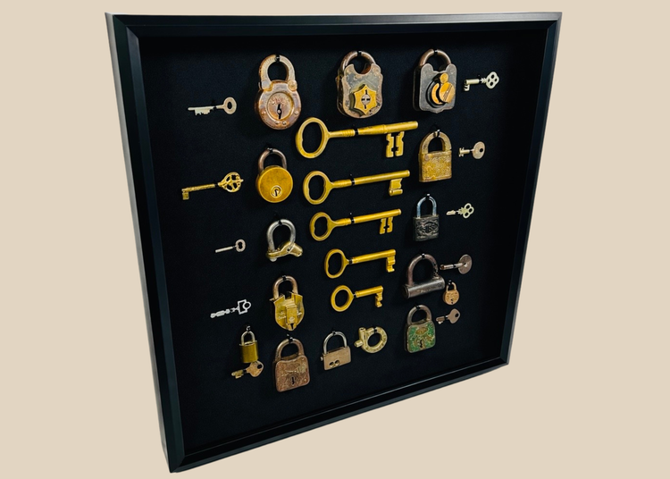 Antique lock and key collection in shadow box frame featuring 15 vintage padlocks and skeleton keys from the 19th century