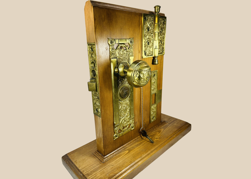Antique Reading Hardware door lock display with brass knob and escutcheon plate