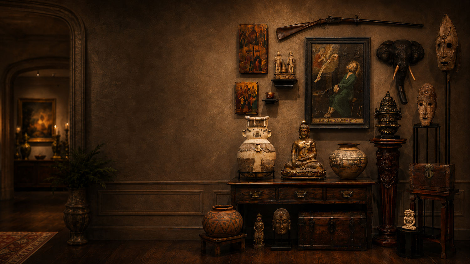 Antique gallery display with religious art, pottery, Buddha statue, masks, carved elephant head, and historical artifacts in a moody interior.