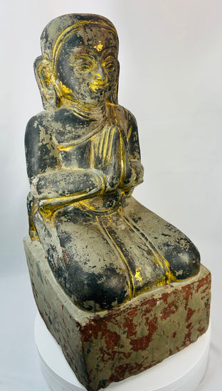 Burmese carved wood sculpture of a kneeling Buddhist devotee with hands in prayer, Mandalay period.
